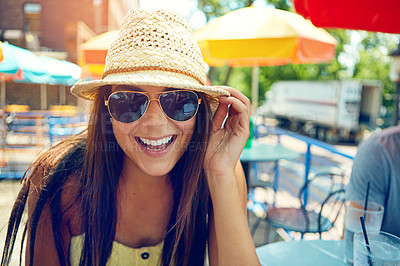 Buy stock photo Portrait of an attractive young woman sitting at an outdoor cafe