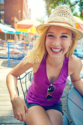 Buy stock photo Portrait of an attractive young woman sitting at an outdoor cafe