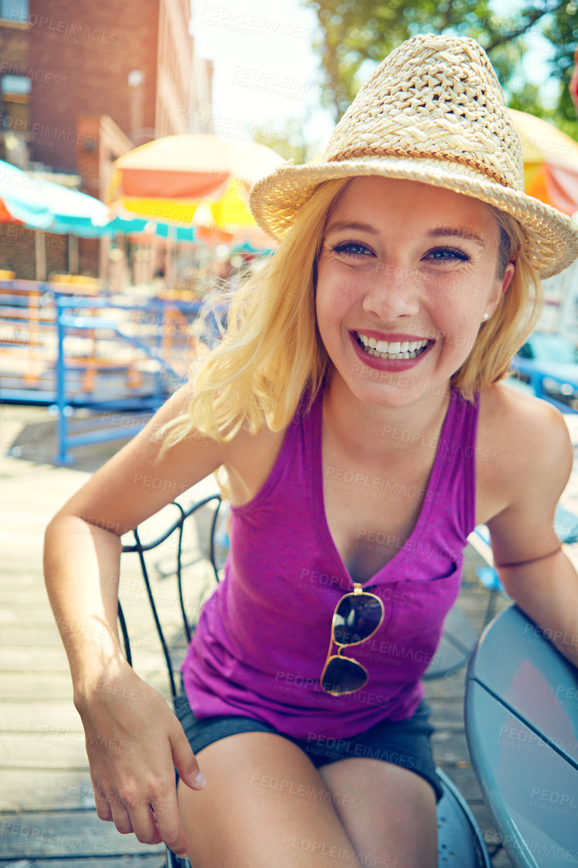 Buy stock photo Portrait of an attractive young woman sitting at an outdoor cafe