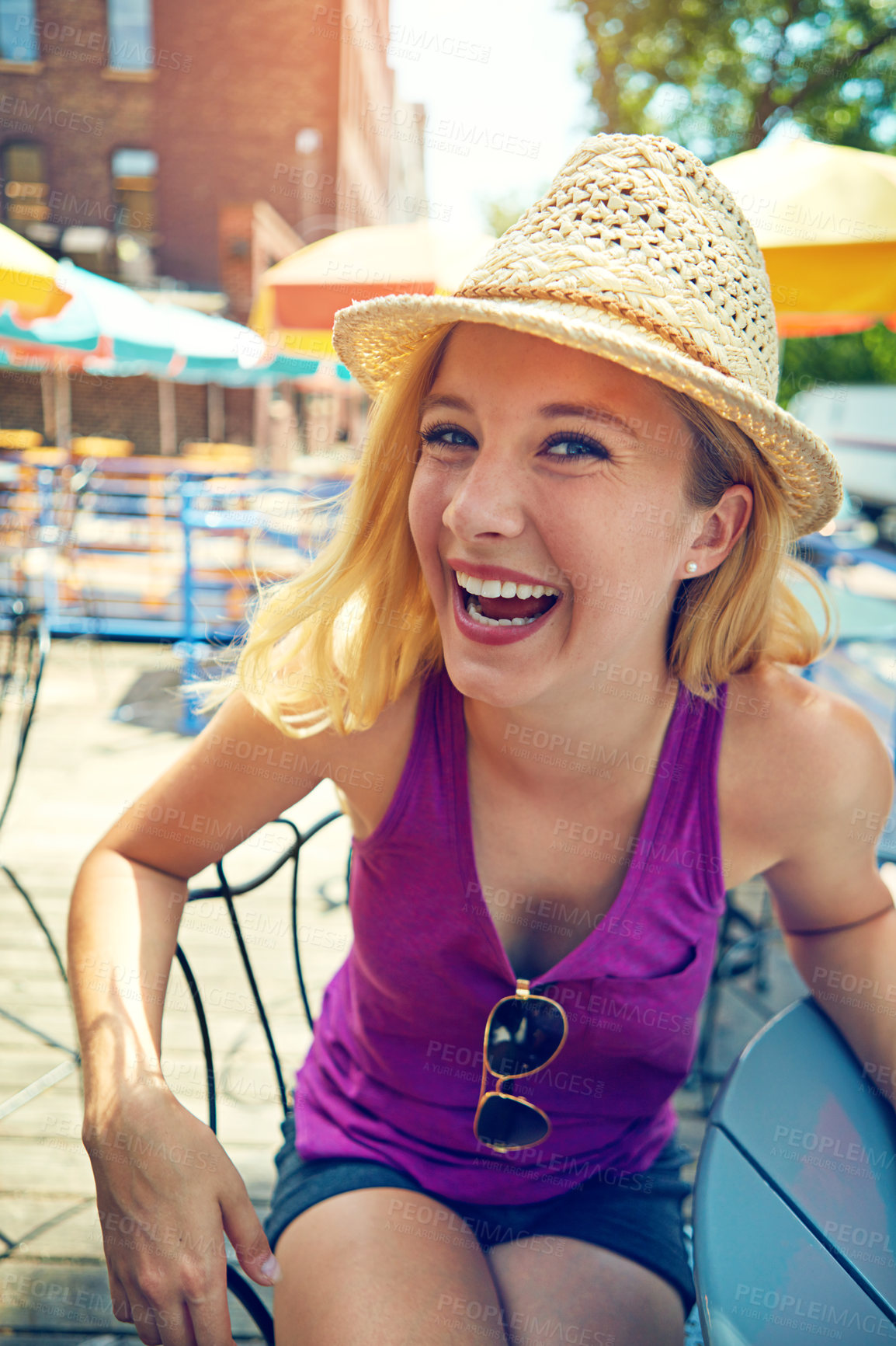 Buy stock photo Portrait of an attractive young woman sitting at an outdoor cafe