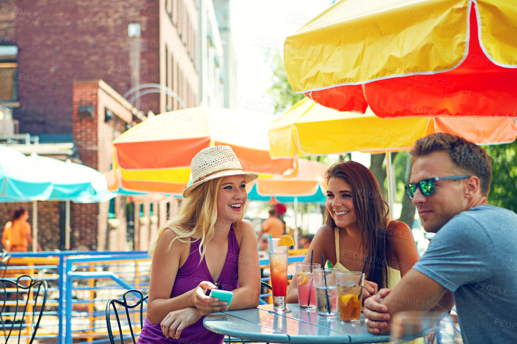 Buy stock photo Friends, phone and laugh at restaurant, drinks and share funny meme on web with alcohol, reunion or party. People, group and happy with smartphone, conversation and mobile app for social media at pub