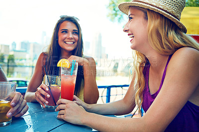 Buy stock photo Shot of a group young friends sitting at an outdoor cafe