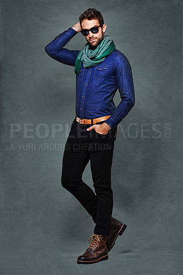 Buy stock photo Fashion, eyewear and studio for male person, stylish and formal clothing isolated on background. Confidence, serious and denim with scarf for man model, pose and casual or trendy contemporary outfit