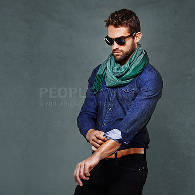 Buy stock photo Fashion, serious and man or model in studio isolated on a gray background mockup space. Confidence, person and roll sleeve on shirt for style in casual clothes, trendy or cool sunglasses with jeans