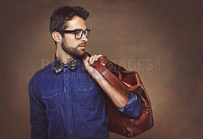 Buy stock photo Travel, bag and man with fashion thinking of vacation in studio, background and mockup for business. Formal, style and luxury leather luggage for airport, journey to Italy and model in glasses