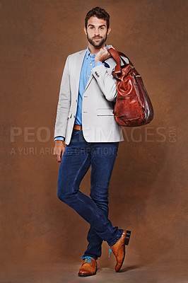 Buy stock photo Travel, fashion and portrait of man with bag in studio, background and mockup for business vacation. Formal, style and luxury luggage for airport, journey to Italy and model in leather shoes and suit