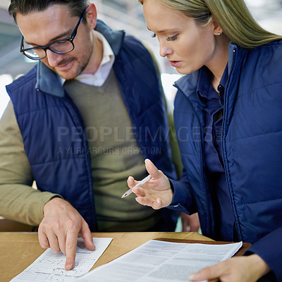 Buy stock photo Business people, reading and pointing with checklist for inventory, storage or supply chain at warehouse. Happy coworkers, team or employees looking at documents, paperwork or distribution at factory