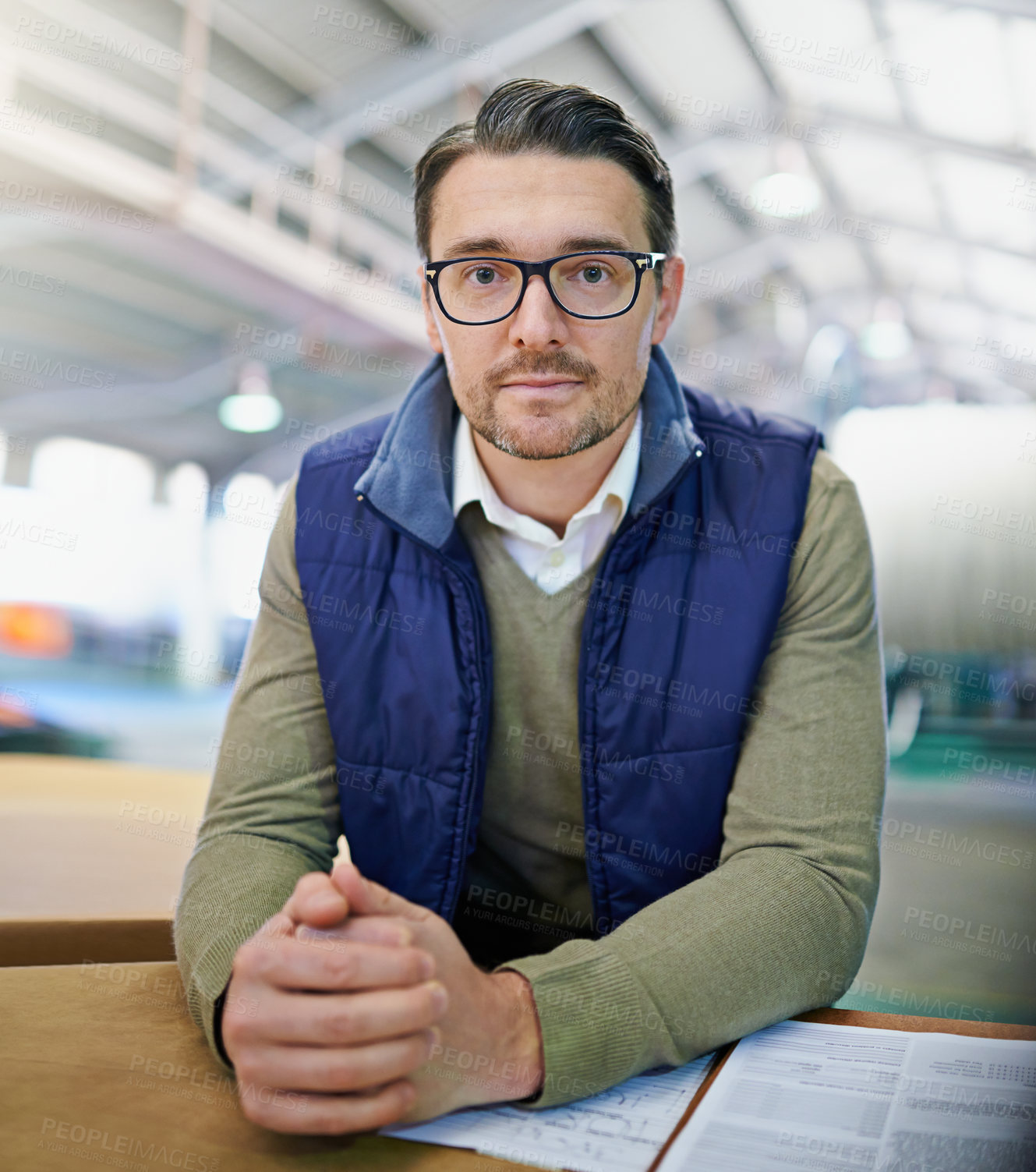 Buy stock photo Portrait, manager and businessman in logistics at factory with machines for supply chain. Mature man, warehouse and table with paperwork for stock take in manufacturing and distribution business