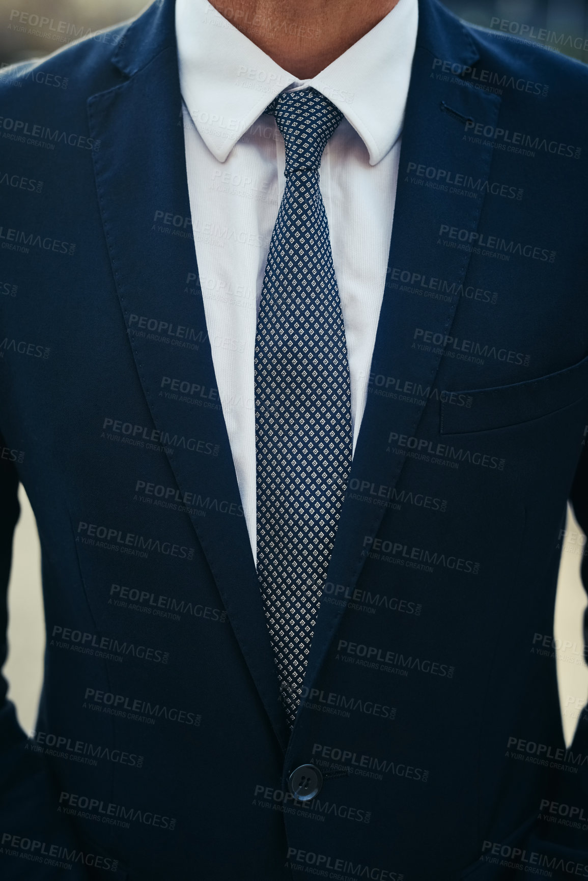 Buy stock photo Shot of an unidentifiable businessman wearing a smart suit