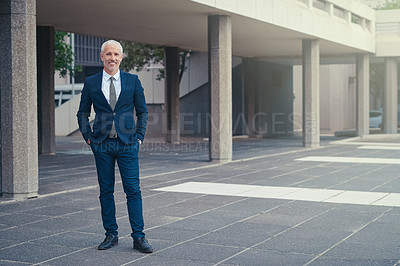 Buy stock photo Portrait of a well dressed businessman standing outside his office building