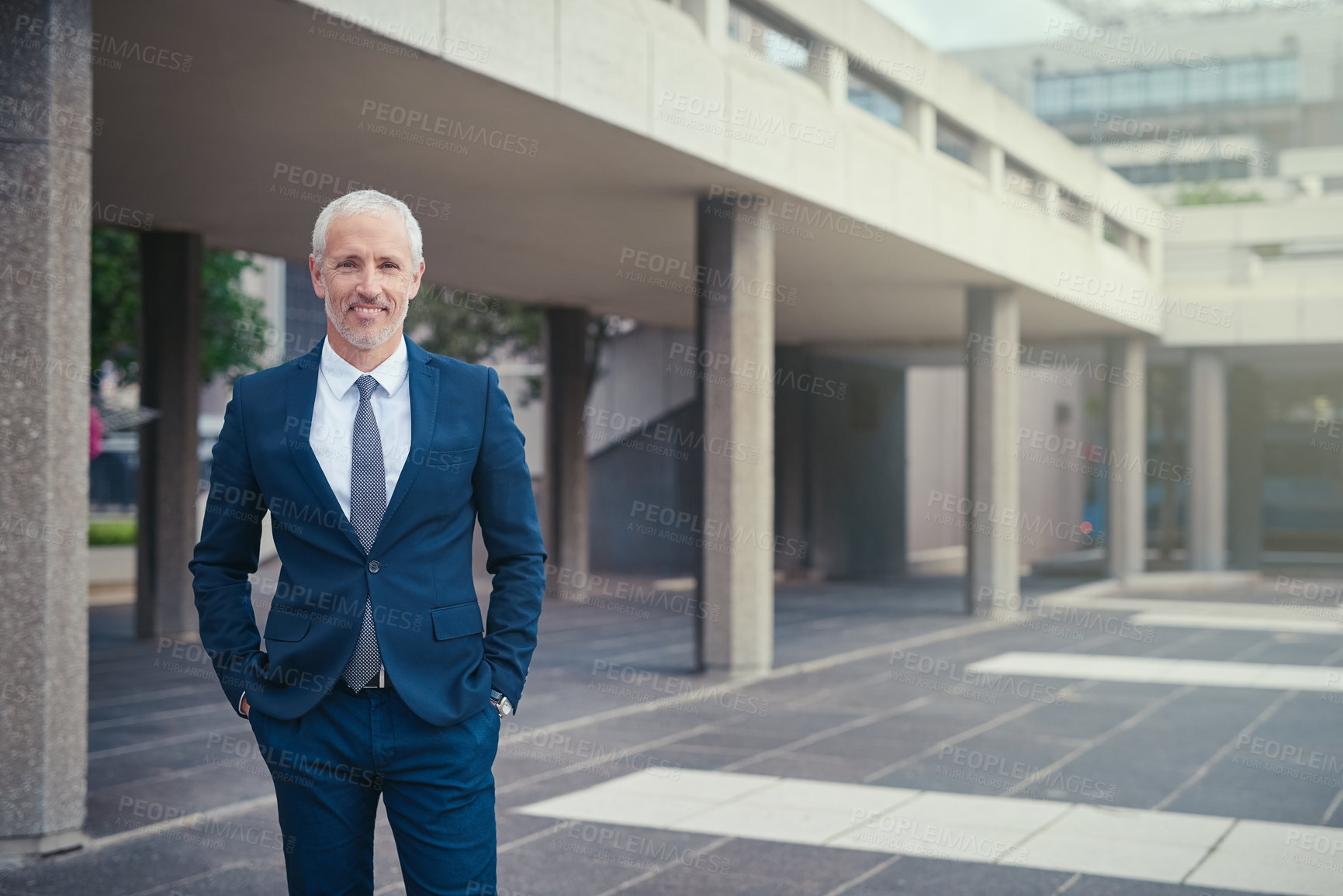Buy stock photo Portrait of a well dressed businessman standing outside his office building
