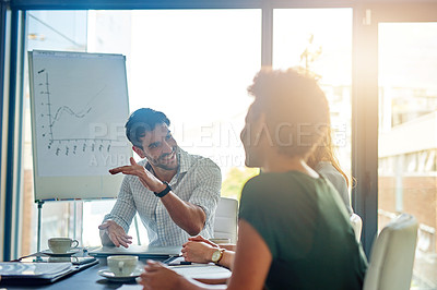 Buy stock photo Speaker, presentation and businessman brainstorming to group, planning or training in startup office meeting. Happy team, manager and financial analyst with data, graph or erp statistics for coaching
