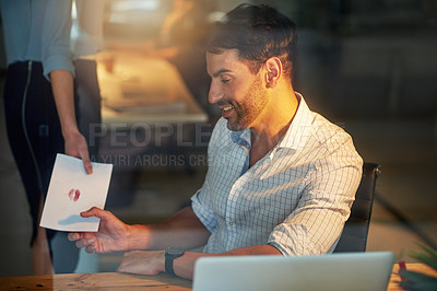Buy stock photo Businessman, smile and working late with love note at office with coworker for workplace, romance and affair. Male person, letter and kiss for secret, relationship and together with colleague for hr