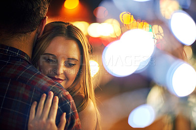 Buy stock photo Shot of a young couple out on a date in the city