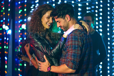 Buy stock photo Smile, dance and couple at night club, party or rave together at social event with bokeh lights for love at bar. Music, man and happy woman at disco with energy, celebration and entertainment concert