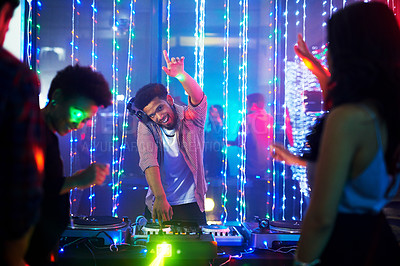 Buy stock photo Portrait of a happy young DJ playing music at a party in a nightclub