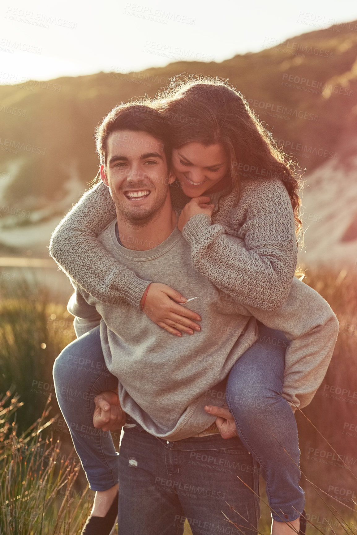 Buy stock photo Happy, couple and back ride at beach for relax, bonding and fun date on summer holiday or weekend. Excited, man and woman with smile in nature for romantic honeymoon, break and commitment with love