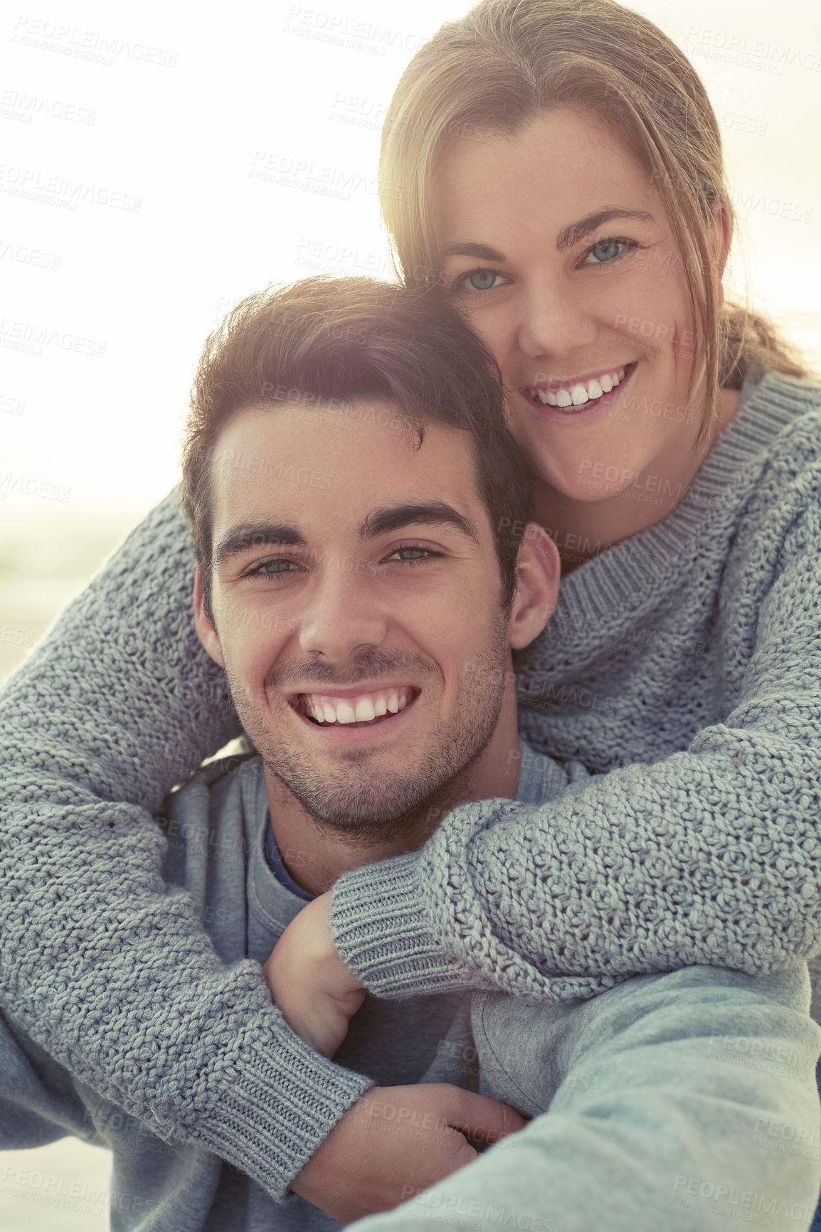 Buy stock photo Couple, people and smile for love, together with support and happy in vacation while bonding. Travel, relax and hugging for dating in weekend for happiness, portrait and affection for cold holiday