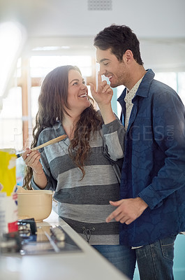 Buy stock photo Happy, couple and fun by cooking in kitchen for romance together on weekend for bonding with playful love at house. Smile, woman and man by touching nose with flour ingredient for food or meal 