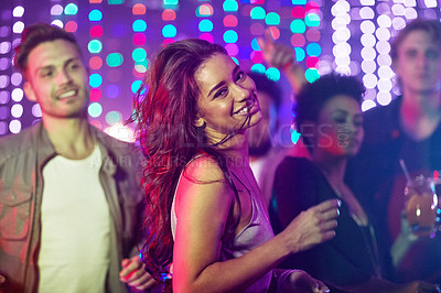 Buy stock photo Portrait, dancing and woman, nightclub and party with friends, smile and celebration for birthday, confidence and fun. Bokeh, group and lights for new year, weekend and countdown in rave with energy