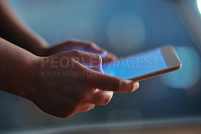 Buy stock photo Cropped shot of a woman using a digital tablet at night