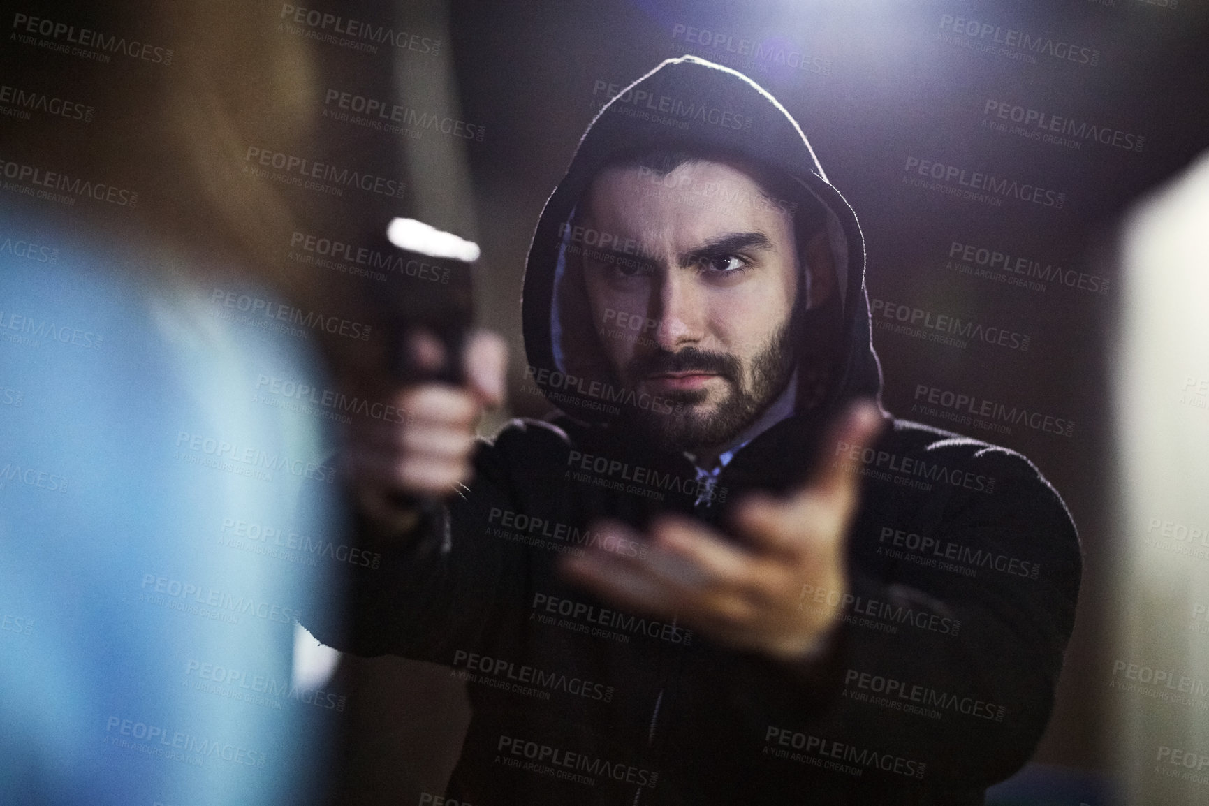 Buy stock photo Man, night and pointing gun with criminal, robbing and hand gesture for armed assault or mugging with thief. Demanding, law breaking and safety concern for victim, serious robber and danger suspect