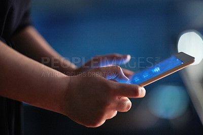Buy stock photo Cropped shot of a woman using a digital tablet at night