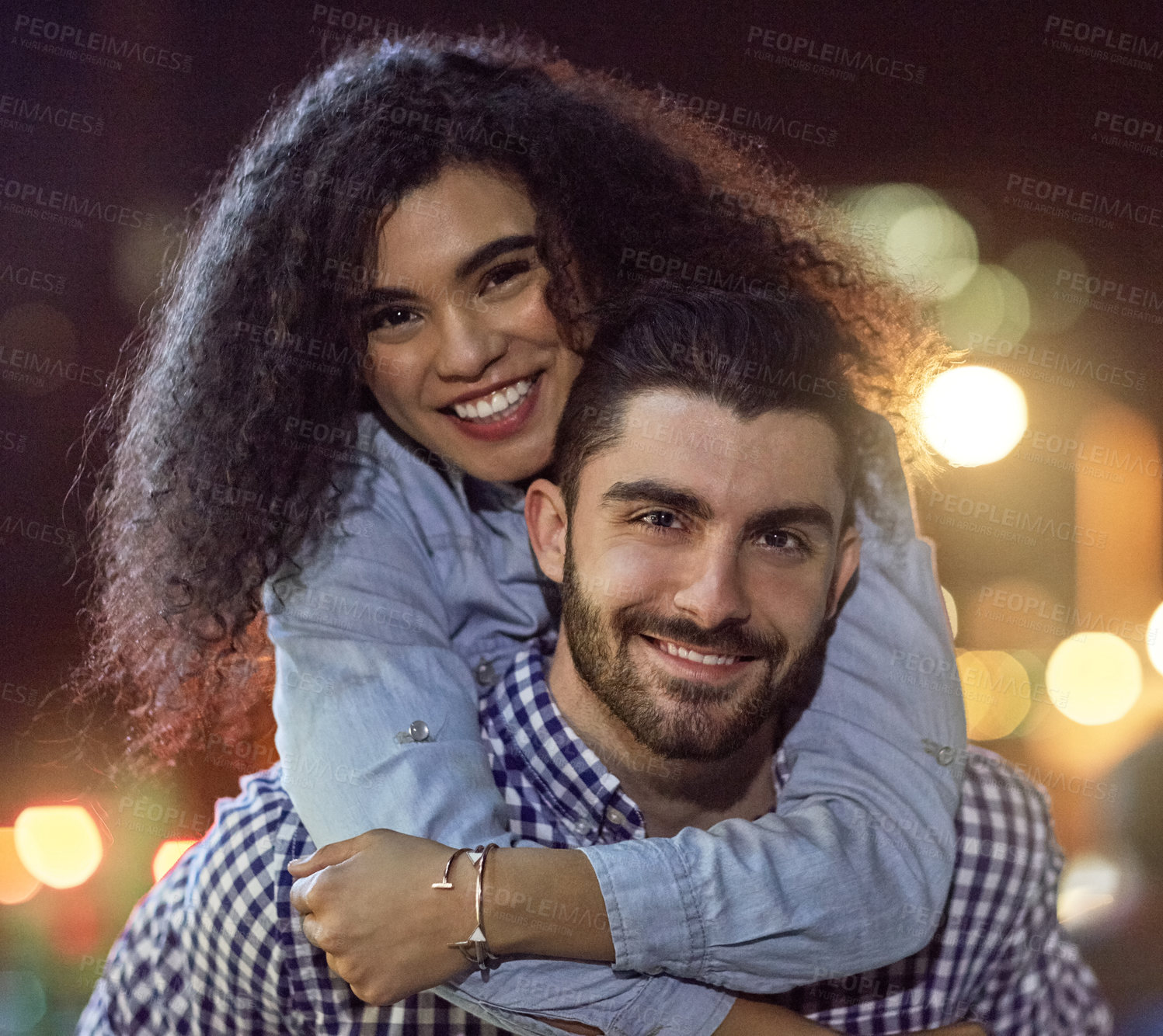 Buy stock photo Portrait, happy couple and night with hug in city for love, care or outdoor embrace together. Young man, woman or lovers with smile or lights in late evening for bonding or affection in an urban town