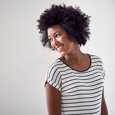 Buy stock photo Studio shot of an attractive and happy young woman posing against a gray background