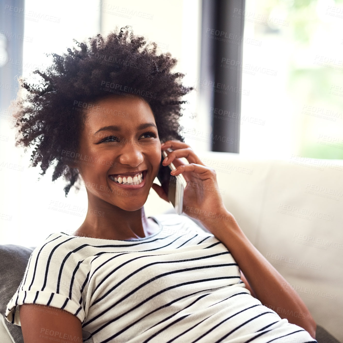 Buy stock photo Happy, black woman and phone call on sofa for chatting, communication and conversation at home. Smile, female person and smartphone on couch for rest and relax with discussion, connection or contact