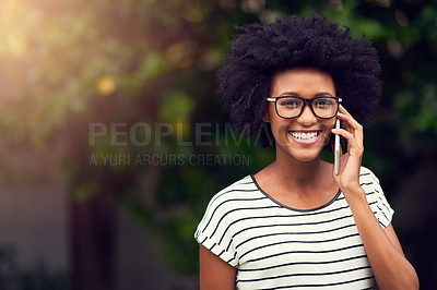 Buy stock photo Portrait of a happy young woman using her phone outdoors