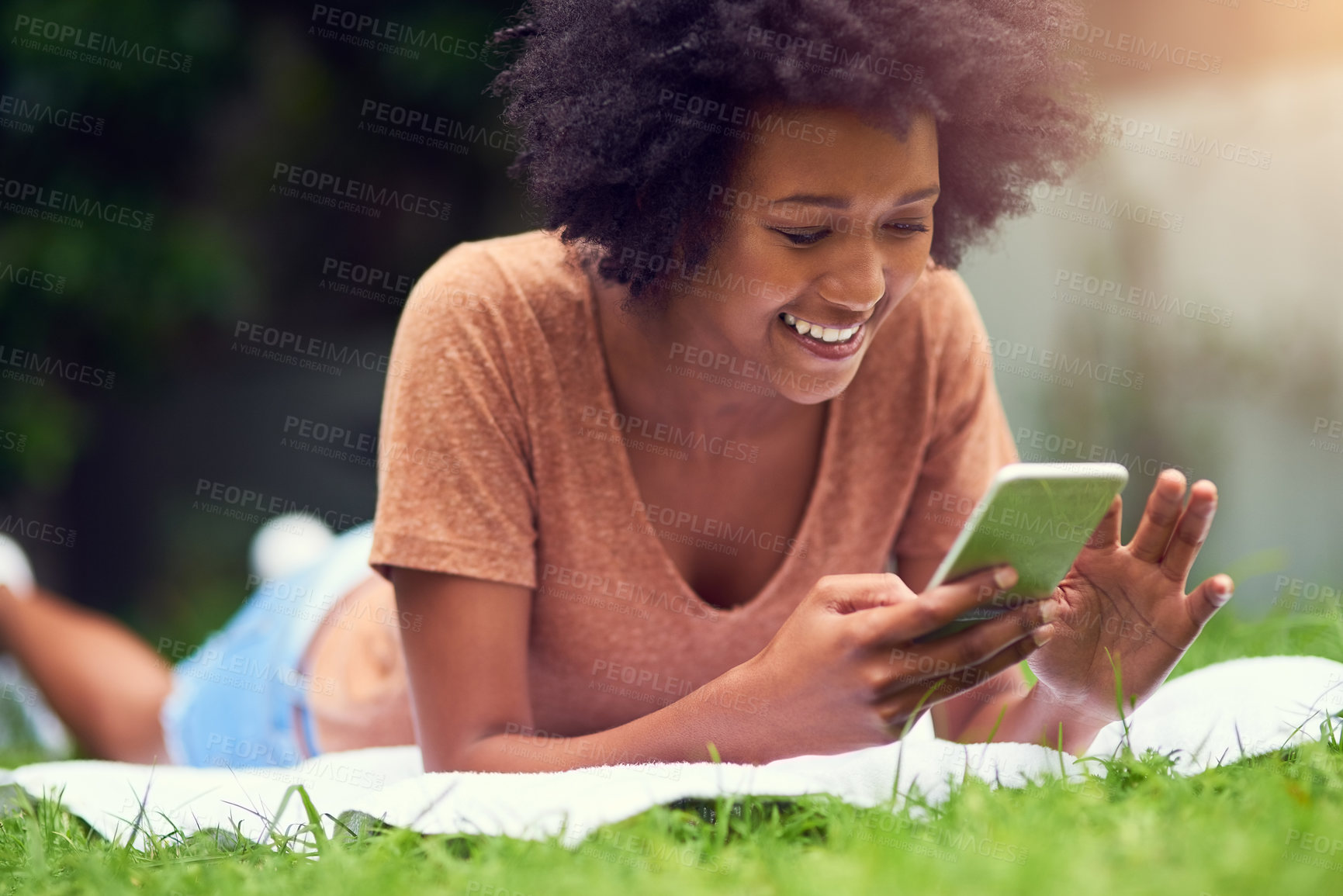 Buy stock photo News, mobile or happy woman in park to relax on social media to chat on internet post or notification. Phone search, smile or gen z girl texting online on blog for gossip meme on blanket in nature