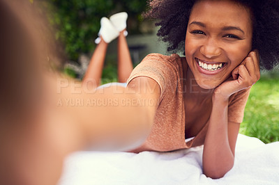 Buy stock photo Shot of a young woman taking a selfie white at the park