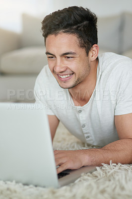 Buy stock photo Man, laptop and student for study in home, floor and browse for research on college project. Male person, lounge and university website for e learning, education and app for knowledge or online class
