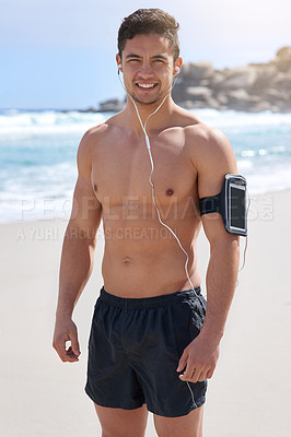 Buy stock photo Portrait of a handsome young man standing on the beach
