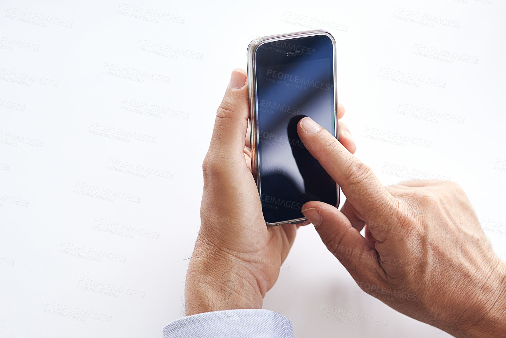 Buy stock photo Closeup shot of a businessman using a cellphone against a white background