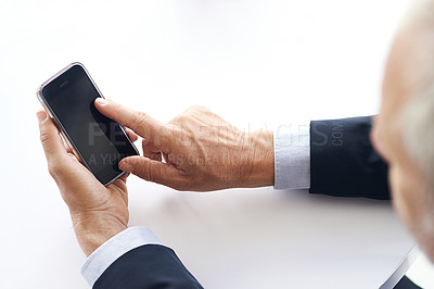 Buy stock photo Cropped shot of a corporate businessman texting on a cellphone against a white background
