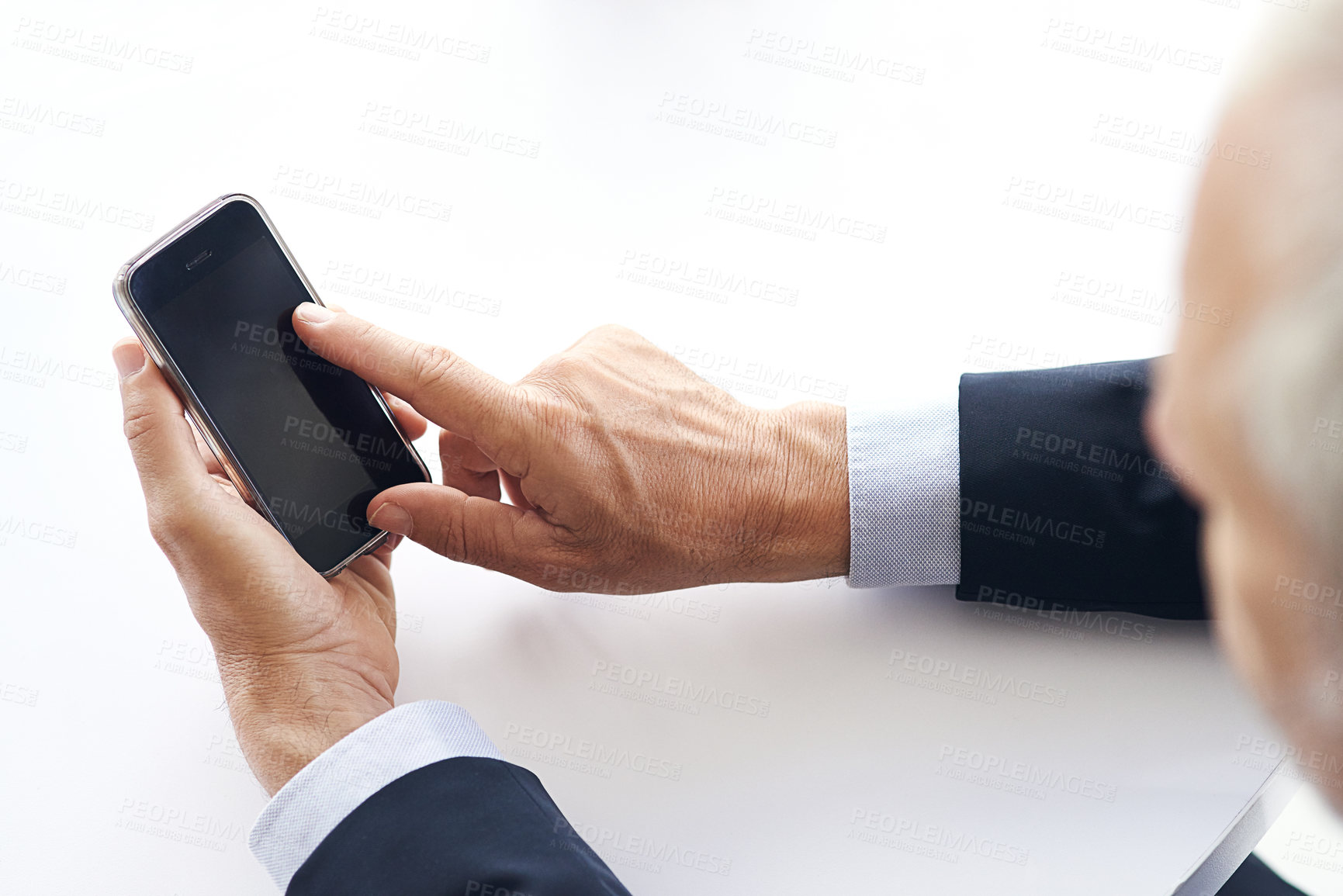 Buy stock photo Cropped shot of a corporate businessman texting on a cellphone against a white background