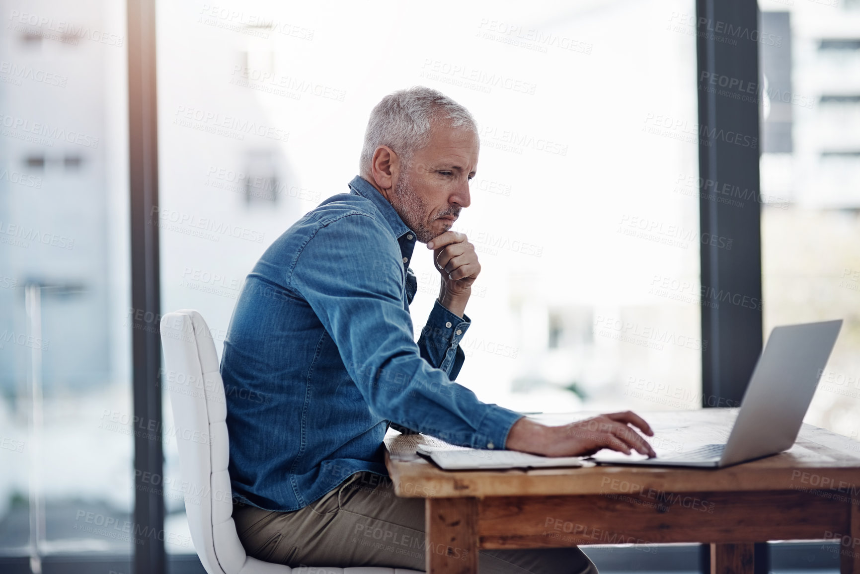 Buy stock photo Mature man, business and thinking with laptop for research information, update and reading finance news. Office, financial advisor and scroll on tech for investment, budget report or portfolio review