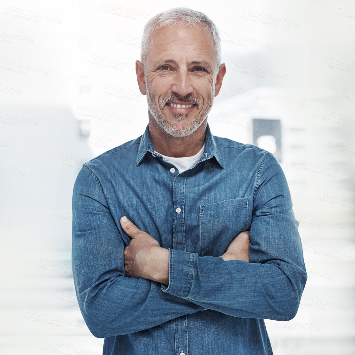 Buy stock photo Arms crossed, portrait and smile of business man in creative workplace for management of design company. Confident, casual and denim with happy mature employee in office for career development