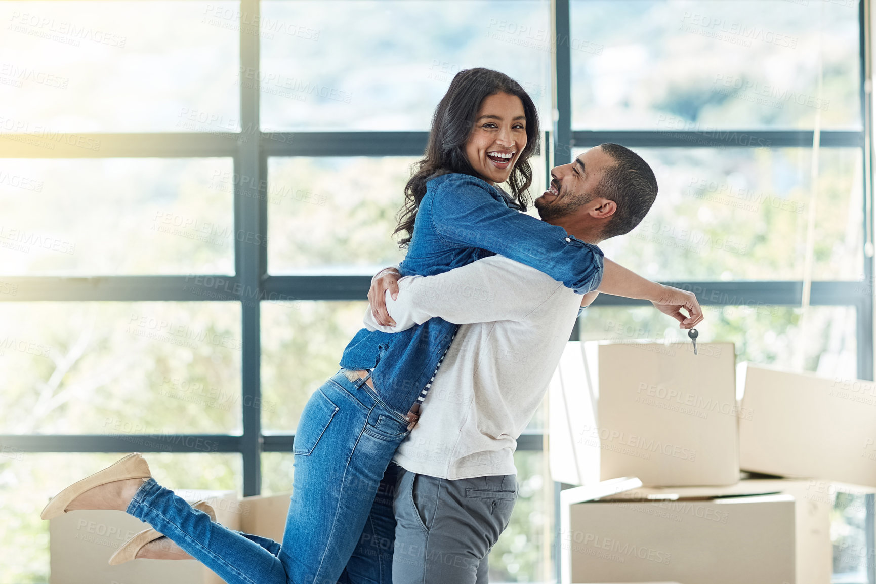 Buy stock photo Couple, portrait and hug with key for new home with support, bonding and happiness for dream house. Homeowner, man and woman in relationship excited for relocation, property investment and moving