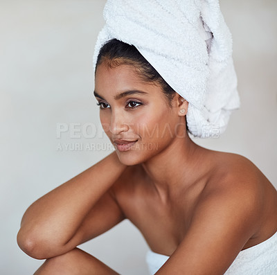 Buy stock photo Spa, woman and thinking in skin care, beauty and cosmetics for glow, healthy and wellbeing. Female person, relax and pride for natural face, makeup and dermatology with towel on background in studio
