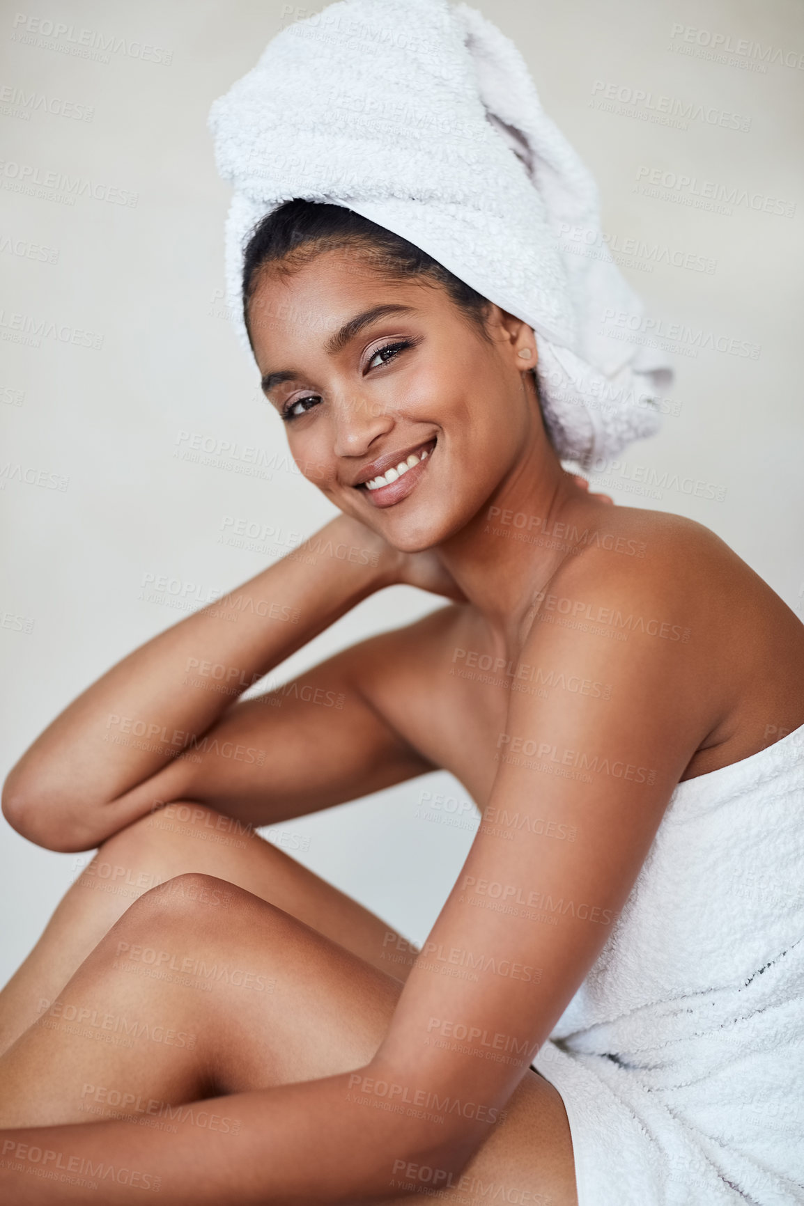 Buy stock photo Spa, woman and portrait with towel skincare, beauty and cosmetics for glow, healthy and wellbeing. Female person, relax and pride for natural face, makeup and dermatology on background in studio
