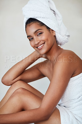 Buy stock photo Beauty, woman and portrait in skincare, spa and cosmetics for glow, healthy and wellbeing. Female person, relax and pride for natural face, makeup and dermatology with towel on background in studio
