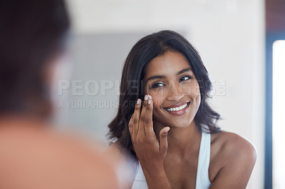 Buy stock photo Skincare, woman and face and reflection in bathroom mirror for grooming and morning routine at home. Indian, female person and dermatology for natural shine or glow with collagen lotion and cream