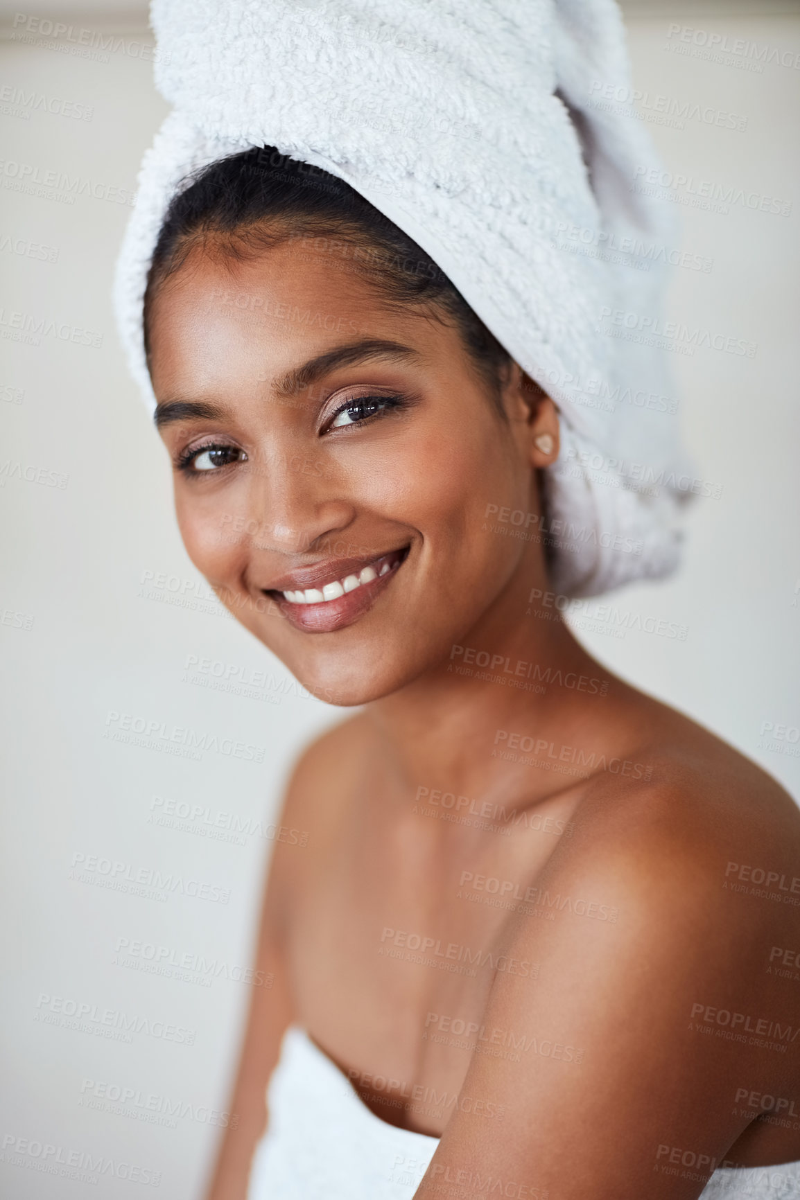 Buy stock photo African woman, skin or towel with face in bathroom for natural beauty, cosmetics with hygiene. Female model, smile or makeup with confidence on gray background in portrait, happiness with aesthetics