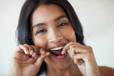 Buy stock photo Woman, flossing and tooth in portrait for dental or wellness, morning routine in bathroom for health. Female person, cleaning and mouth for gum hygiene with tape, teeth with results for healthcare