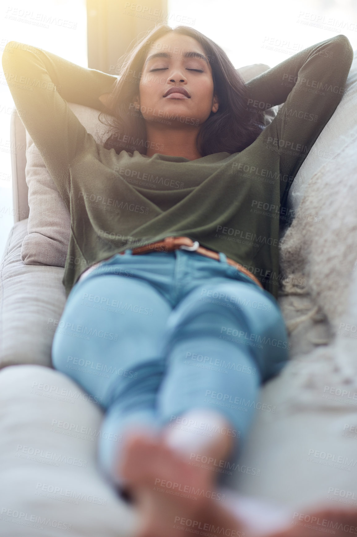 Buy stock photo Home, relax and woman on couch, sleeping and breathing with afternoon nap, peaceful and calm in living room. Apartment, happy person and girl on couch, eyes closed and hand behind her head with break