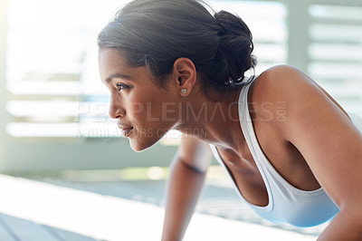 Buy stock photo Shot of a sporty young woman working out