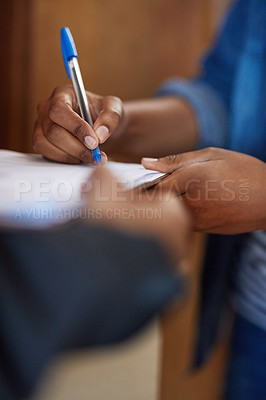 Buy stock photo Shot of an unreconizable woman signing for a delivery